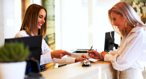 two woman smiling