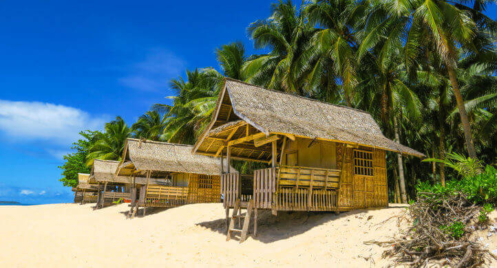 cotage on a white sand beach