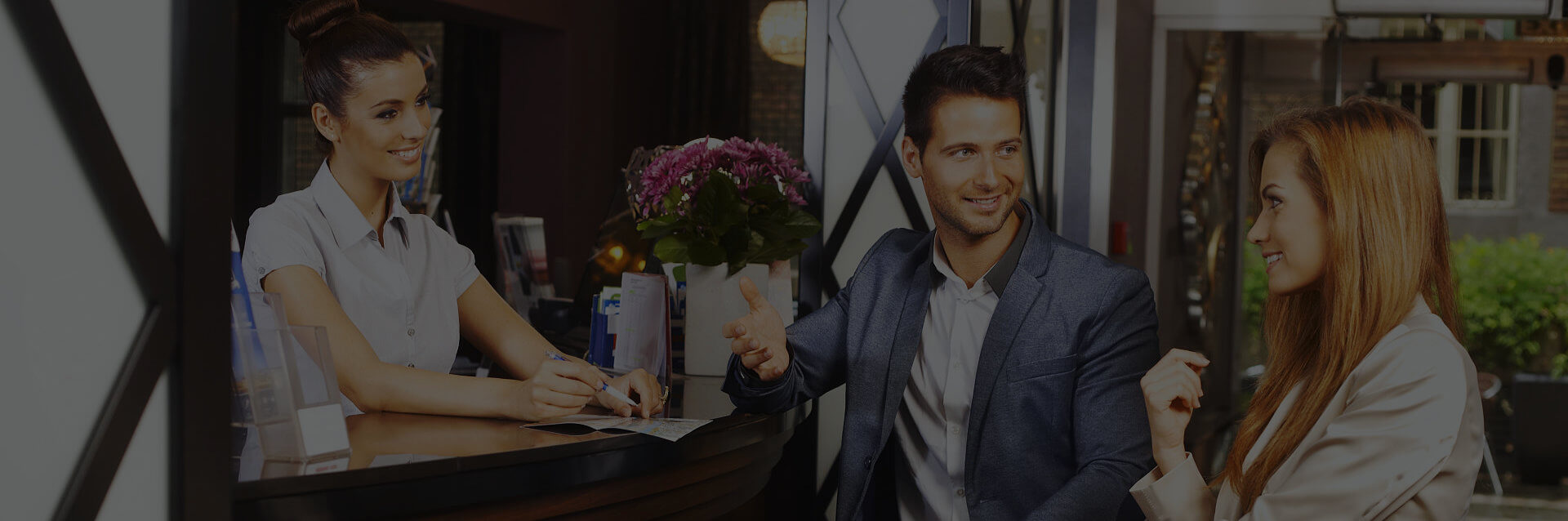 young couple talking at the front desk