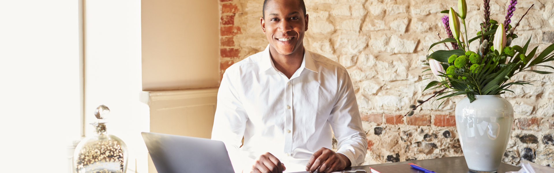 man working at the front desk