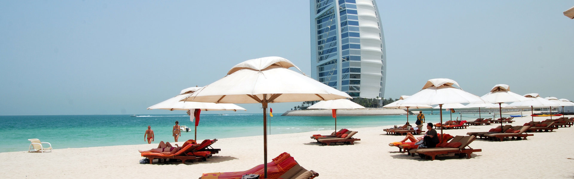 relaxing beach with hotel in the background